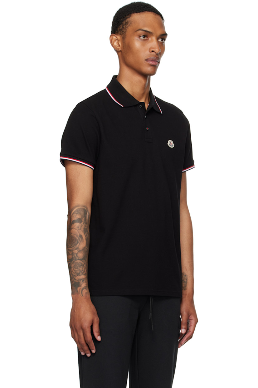 Slim-fit organic cotton piqué polo. 

· Tricolor striped rib-knit spread collar and cuffs
· Three-button placket
· Felted tricolor logo patch at chest
· Tennis-tail hem
· Logo-engraved hardware

Supplier color: Black