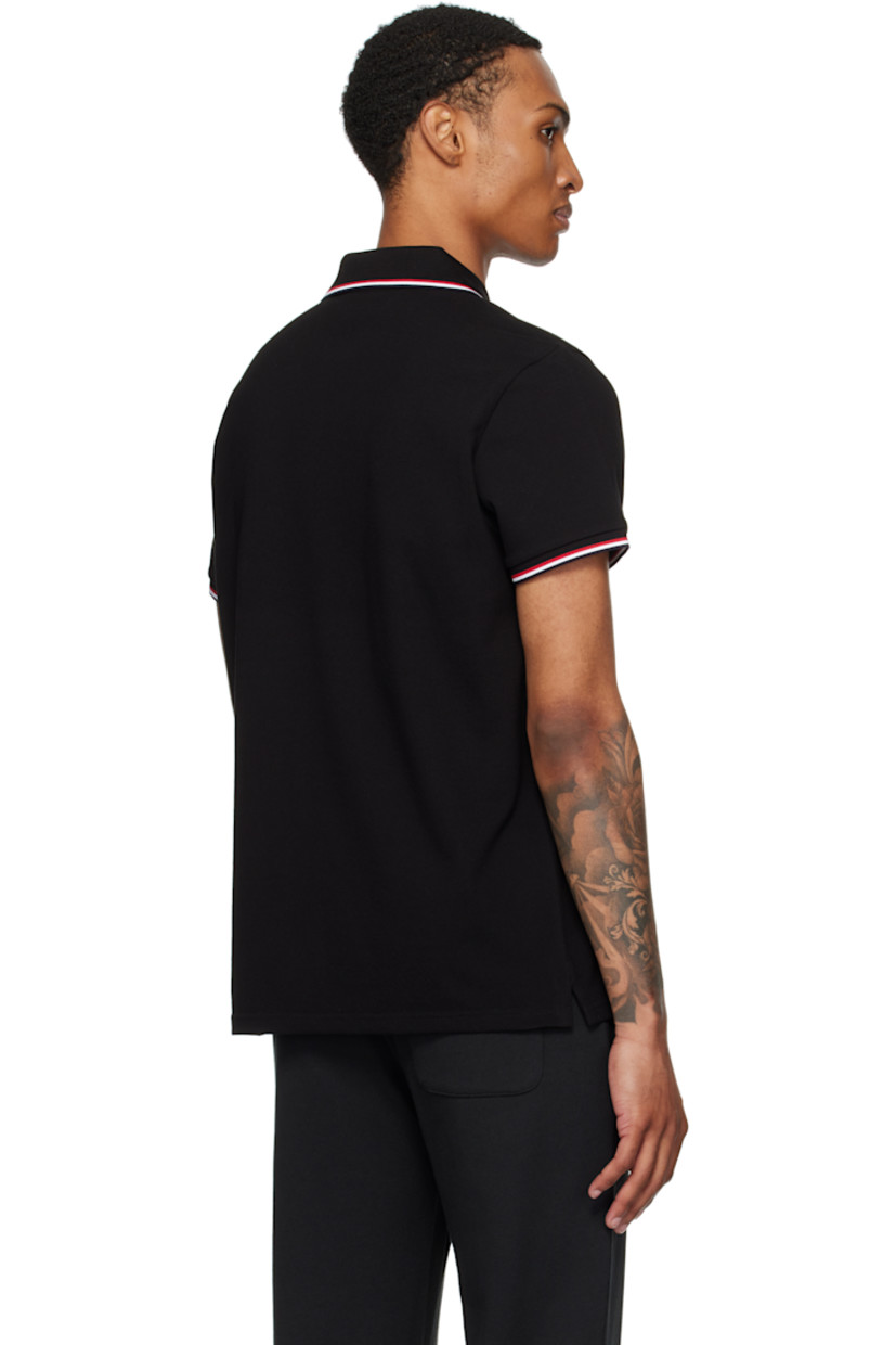 Slim-fit organic cotton piqué polo. 

· Tricolor striped rib-knit spread collar and cuffs
· Three-button placket
· Felted tricolor logo patch at chest
· Tennis-tail hem
· Logo-engraved hardware

Supplier color: Black