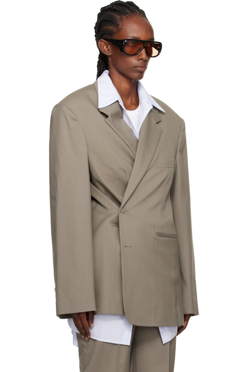 Stretch virgin wool-blend cavalry twill blazer.

· Notched lapel
· Button closure
· Darts at chest
· Welt pockets
· Padded shoulders
· Surgeon's cuffs
· Welt pockets at interior
· Satin lining
· Logo-engraved horn hardware

Supplier color: Taupe
