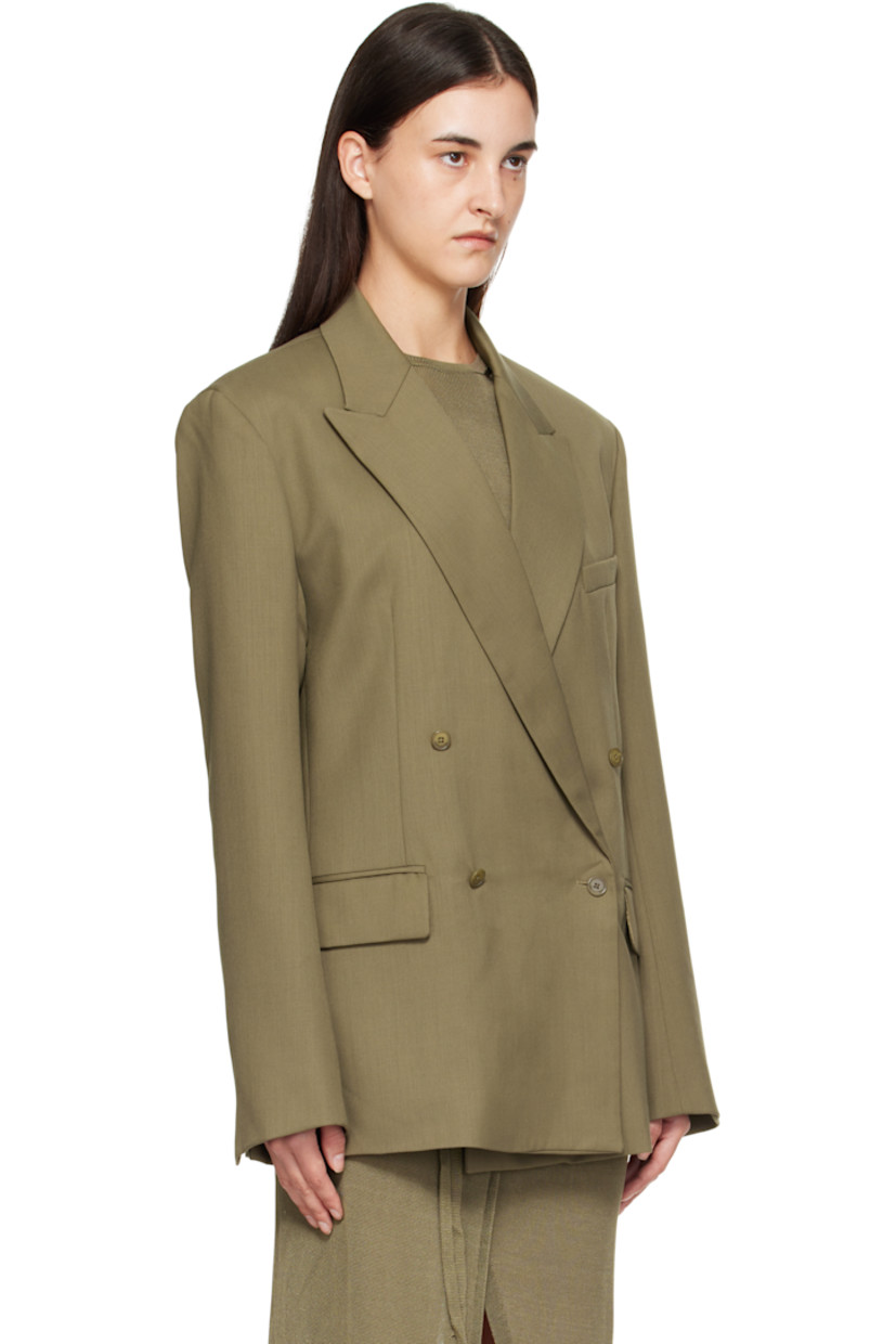 Lightweight virgin wool-blend twill blazer.

· Peaked lapel
· Double-breasted button closure
· Welt pocket at chest
· Flap pockets at front
· Padded shoulders
· Surgeon's cuffs
· Welt pocket at interior
· Full satin lining

Supplier color: Khaki