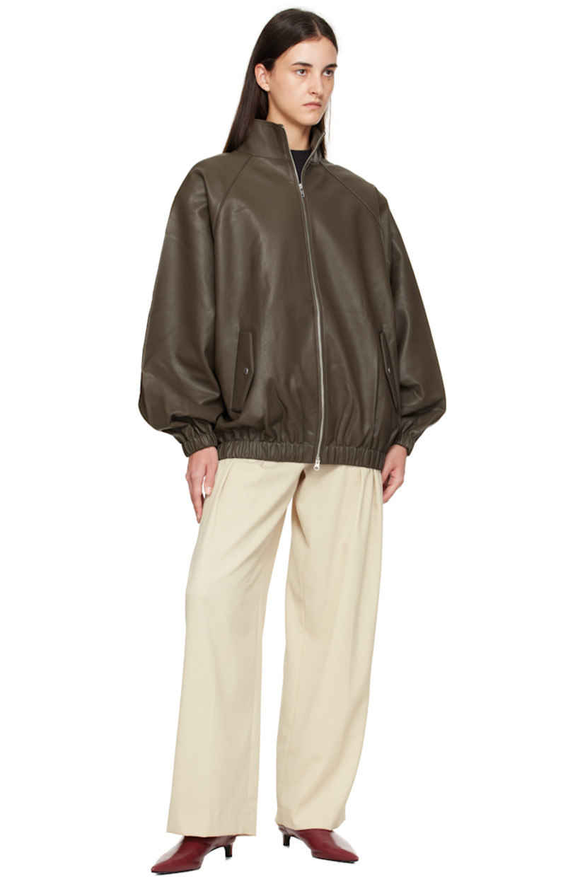 Grained faux-leather bomber-style jacket. 

· Stand collar
· Two-way zip closure
· Press-stud flap pockets at waist
· Elasticized hem and cuffs
· Raglan sleeves
· Storm flap at back
· Full satin lining

Supplier color: Khaki Brown