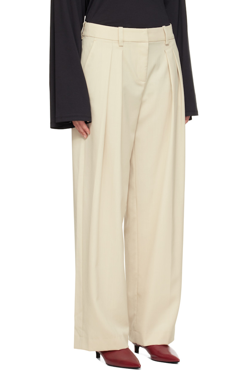 Virgin wool-blend twill trousers.

· Wide-leg
· High-rise
· Belt loops
· Three-pocket styling
· Zip fly
· Pleats at front
· Creased legs

Supplier color: Cement
