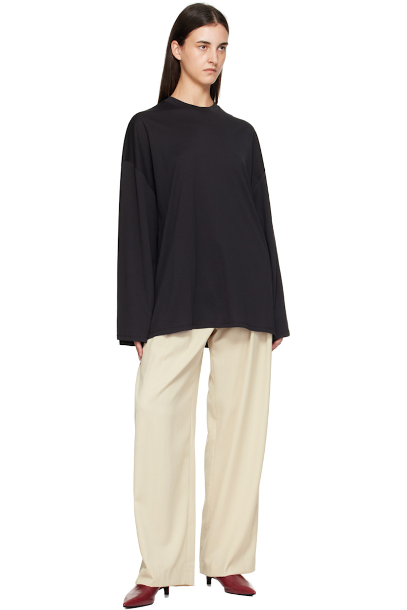 Virgin wool-blend twill trousers.

· Wide-leg
· High-rise
· Belt loops
· Three-pocket styling
· Zip fly
· Pleats at front
· Creased legs

Supplier color: Cement