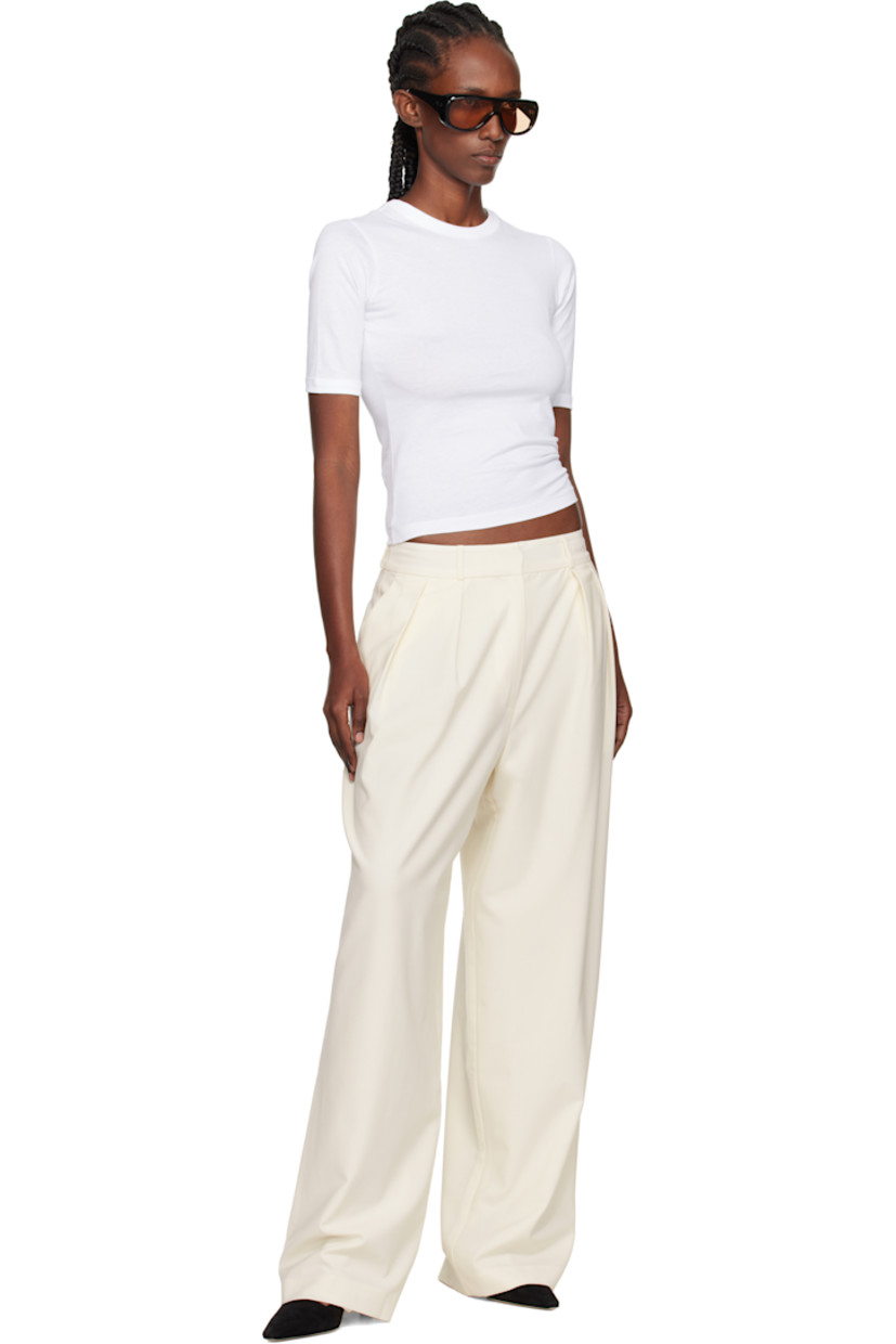 Lightweight plain-woven stretch virgin wool-blend trousers. 

· Wide-leg
· Belt loops
· Three-pocket styling
· Zip fly
· Pleats at front waistband
· Darts at back waistband
· Full satin lining

Supplier color: Ivory