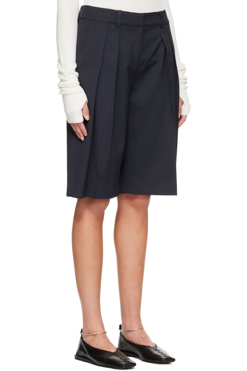 Virgin wool-blend twill shorts.

· High-rise
· Belt loops
· Three-pocket styling
· Zip fly
· Pleats at front
· Creased legs

Supplier color: Navy