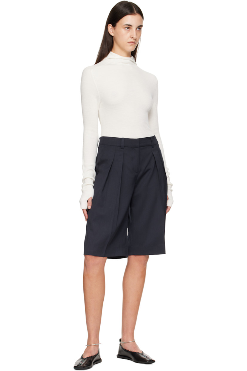 Virgin wool-blend twill shorts.

· High-rise
· Belt loops
· Three-pocket styling
· Zip fly
· Pleats at front
· Creased legs

Supplier color: Navy