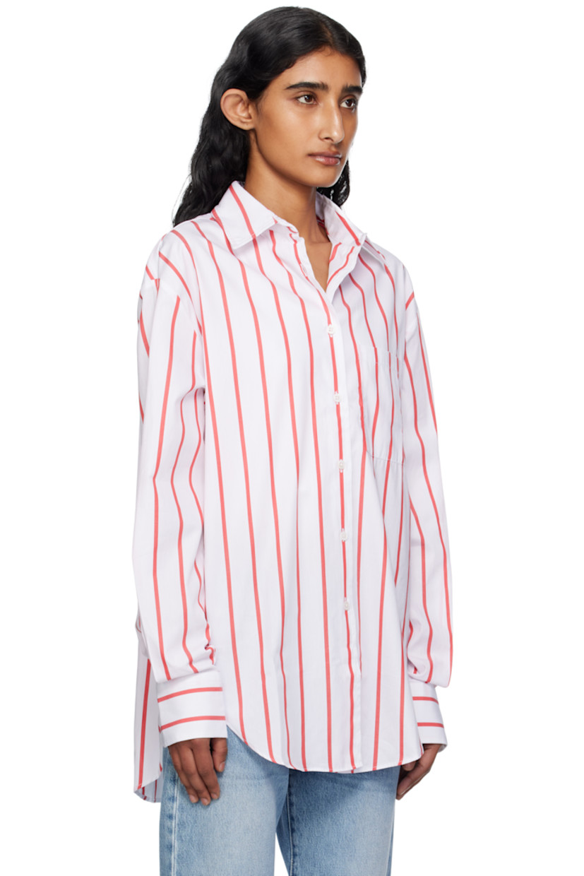 Lightweight cotton poplin shirt.

· Stripes throughout
· Spread collar
· Button closure
· Patch pocket at chest
· Shirttail hem
· Vented side seams 
· Dropped shoulders 
· Logo embroidered at cuff
· Barrel cuffs
· Twin pleats at back yoke

Supplier color: White/Red stripe