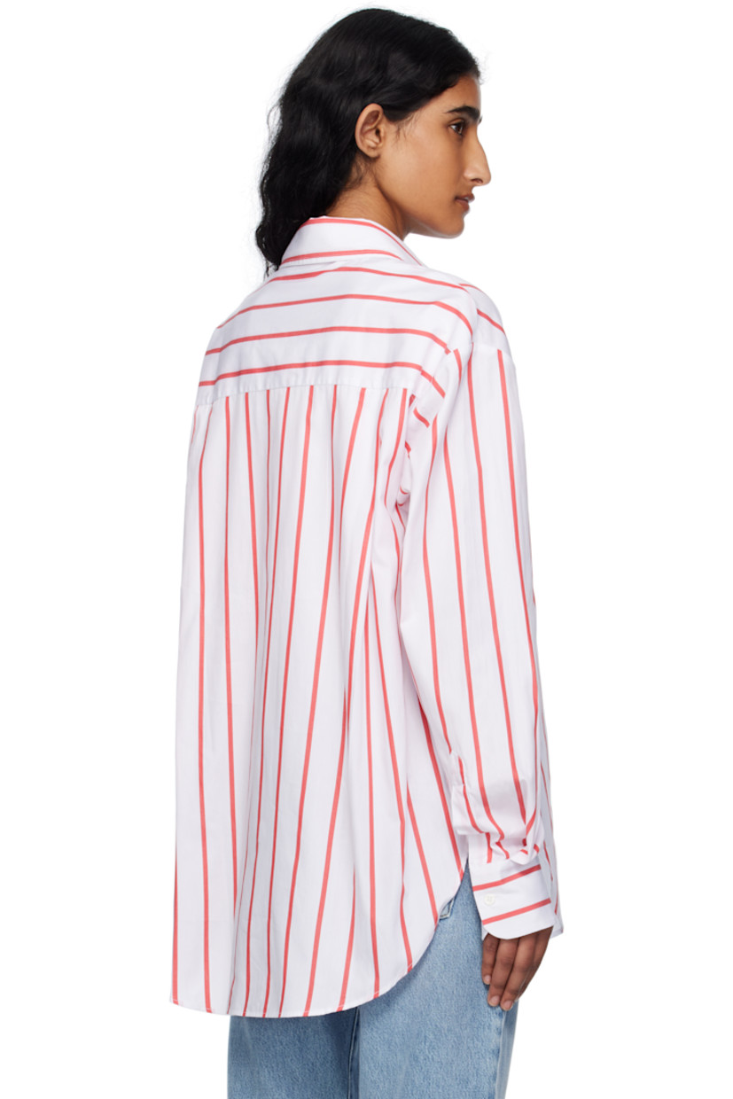Lightweight cotton poplin shirt.

· Stripes throughout
· Spread collar
· Button closure
· Patch pocket at chest
· Shirttail hem
· Vented side seams 
· Dropped shoulders 
· Logo embroidered at cuff
· Barrel cuffs
· Twin pleats at back yoke

Supplier color: White/Red stripe