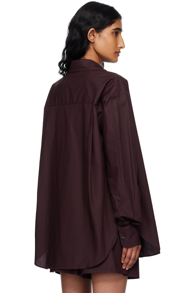 Lightweight organic cotton poplin shirt. 

· Spread collar
· Button closure
· Patch pocket at chest
· Shirttail hem
· Vented side seams 
· Dropped shoulders 
· Logo embroidered at cuff
· Barrel cuffs
· Twin pleats at back yoke

Supplier color: Dark plum