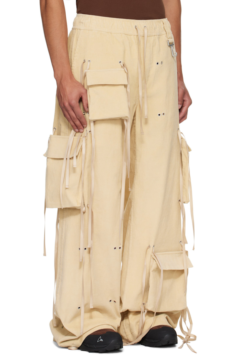 Cotton corduroy cargo pants.

· Wide-leg 
· Self-tie drawstrings and grommets throughout 
· Elasticized waistband
· Four-pocket styling
· Mock fly 
· Loop and logo-engraved carabiner at front waist 
· Detachable cargo pockets at legs

Supplier color: Khaki