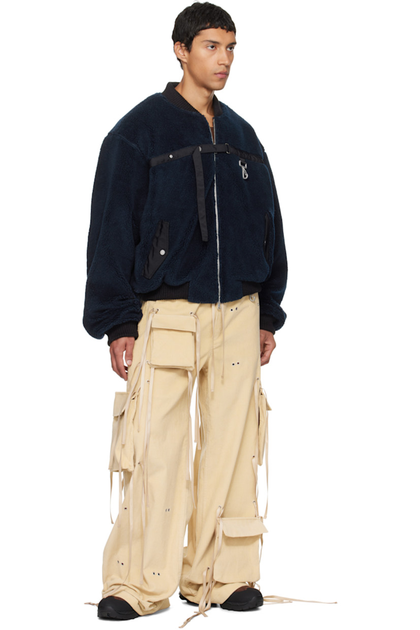 Cotton corduroy cargo pants.

· Wide-leg 
· Self-tie drawstrings and grommets throughout 
· Elasticized waistband
· Four-pocket styling
· Mock fly 
· Loop and logo-engraved carabiner at front waist 
· Detachable cargo pockets at legs

Supplier color: Khaki