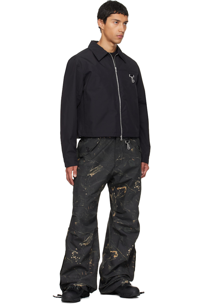 Cotton ripstop cargo pants.

· Camouflage pattern printed throughout
· Wide-leg 
· Belt loops
· Four-pocket styling
· Zip fly 
· Loop and logo-engraved carabiner at front waist 
· Flap pocket at outseams
· Darts at knees
· Buttoned vent at self-tie drawstring at cuffs

Supplier color: Camo