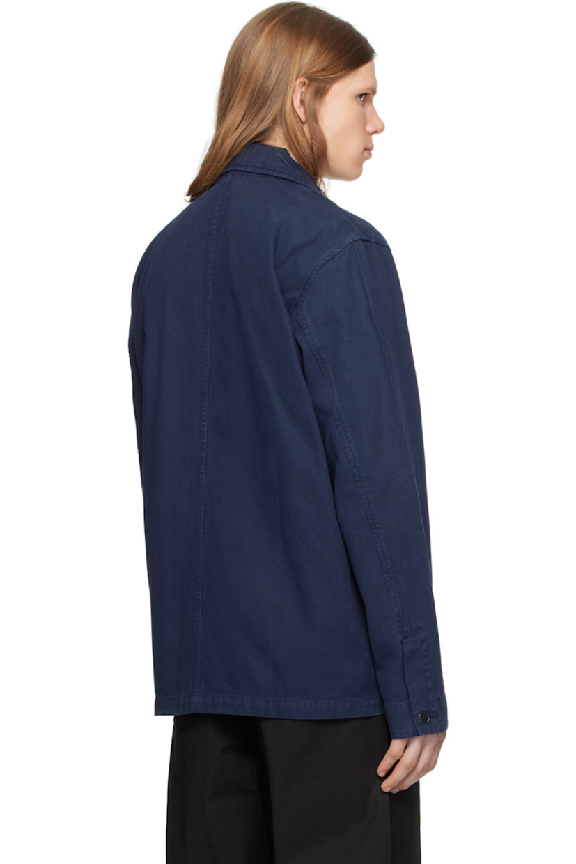 Boxy-fit cotton twill overshirt. 

· Spread collar
· Button closure
· Logo flag at patch pocket
· Seam pockets
· Buttoned barrel cuffs
· Corozo hardware

Supplier color: Workwear blue