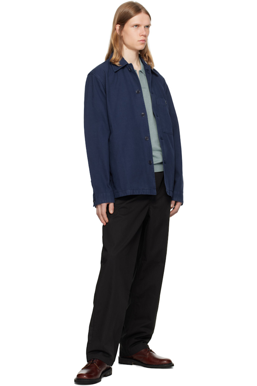 Boxy-fit cotton twill overshirt. 

· Spread collar
· Button closure
· Logo flag at patch pocket
· Seam pockets
· Buttoned barrel cuffs
· Corozo hardware

Supplier color: Workwear blue