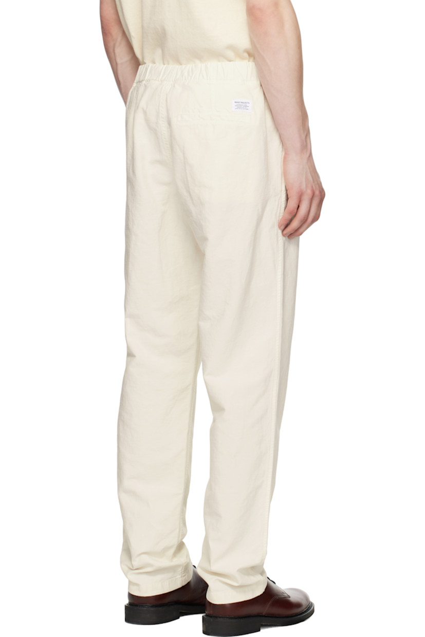 Garment-dyed cotton- and linen-blend twill trousers.

· Concealed drawstring at elasticized waistband
· Three-pocket styling
· Zip fly
· Logo patch at back pocket

Supplier color: Kit white