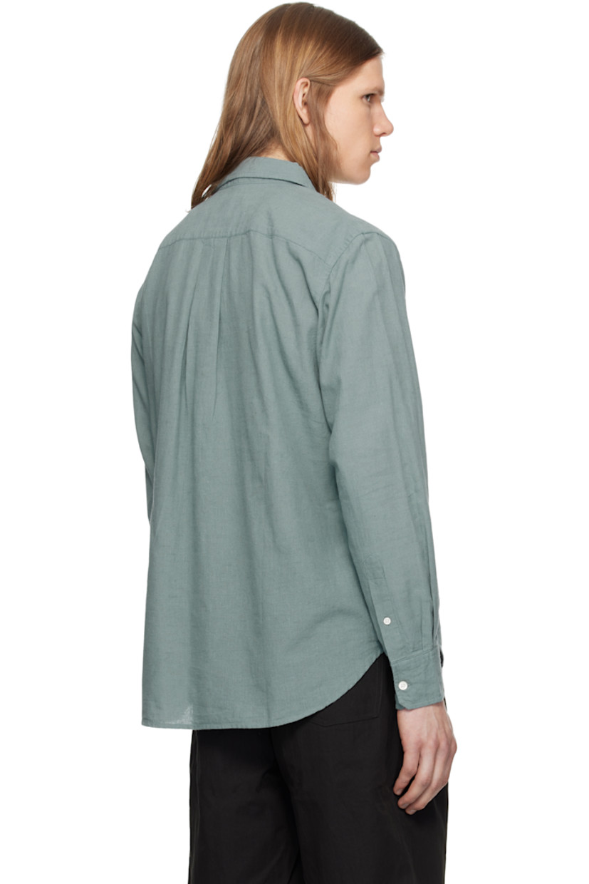 Lightweight cotton- and linen-blend chambray shirt.

· Spread collar
· Button closure
· Patch pocket
· Shirttail hem
· Adjustable buttoned barrel cuffs
· Box pleat at back yoke
· Mother-of-pearl hardware

Supplier color: Greyish blue
