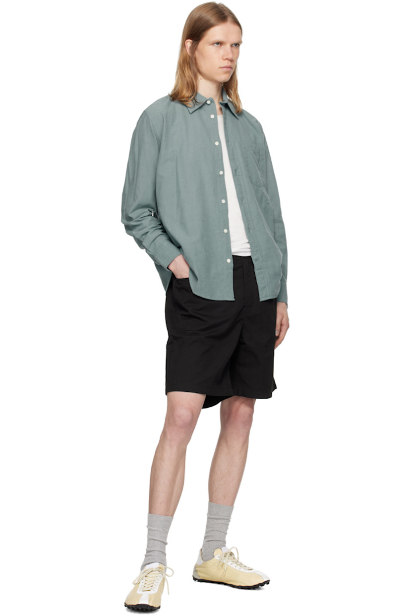 Lightweight cotton- and linen-blend chambray shirt.

· Spread collar
· Button closure
· Patch pocket
· Shirttail hem
· Adjustable buttoned barrel cuffs
· Box pleat at back yoke
· Mother-of-pearl hardware

Supplier color: Greyish blue