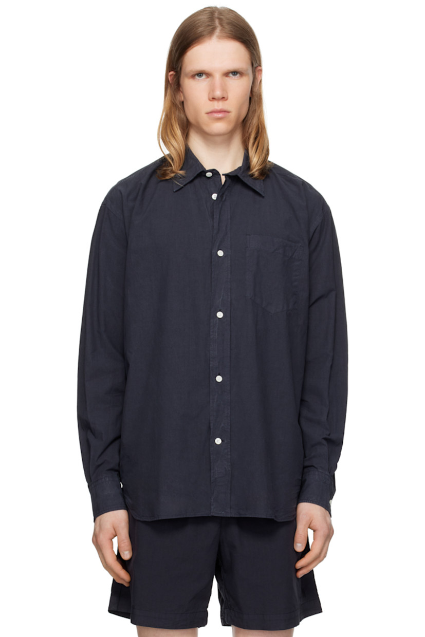 Cotton- and tencel-blend poplin shirt.

· Spread collar
· Button closure
· Patch pocket
· Shirttail hem
· Adjustable buttoned barrel cuffs
· Box pleat at back yoke
· Mother-of-pearl hardware

Supplier color: Dark navy