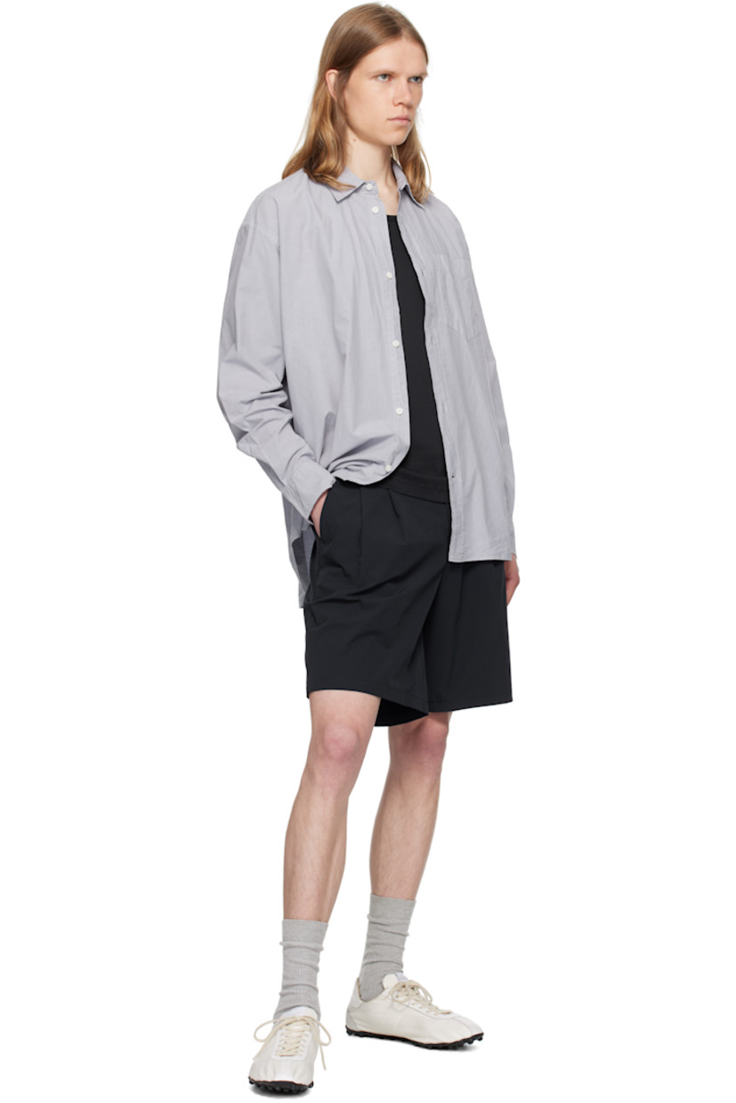 Cotton- and tencel-blend poplin shirt.

· Spread collar
· Button closure
· Patch pocket
· Shirttail hem
· Adjustable buttoned barrel cuffs
· Box pleat at back yoke
· Mother-of-pearl hardware

Supplier color: Crocus purple
