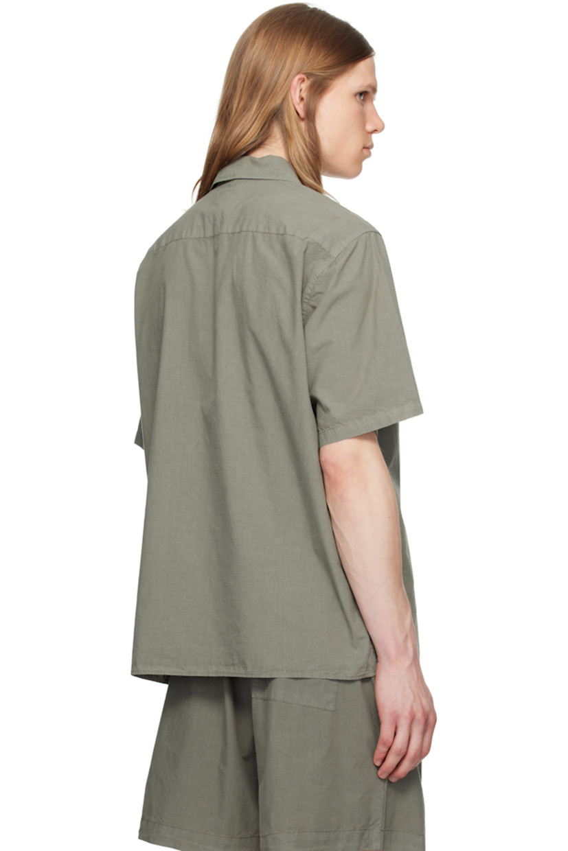 Garment-dyed cotton- and tencel-blend poplin shirt.

· Open spread collar
· Button closure
· Patch pocket
· Mother-of-pearl hardware

Supplier color: Mid khaki