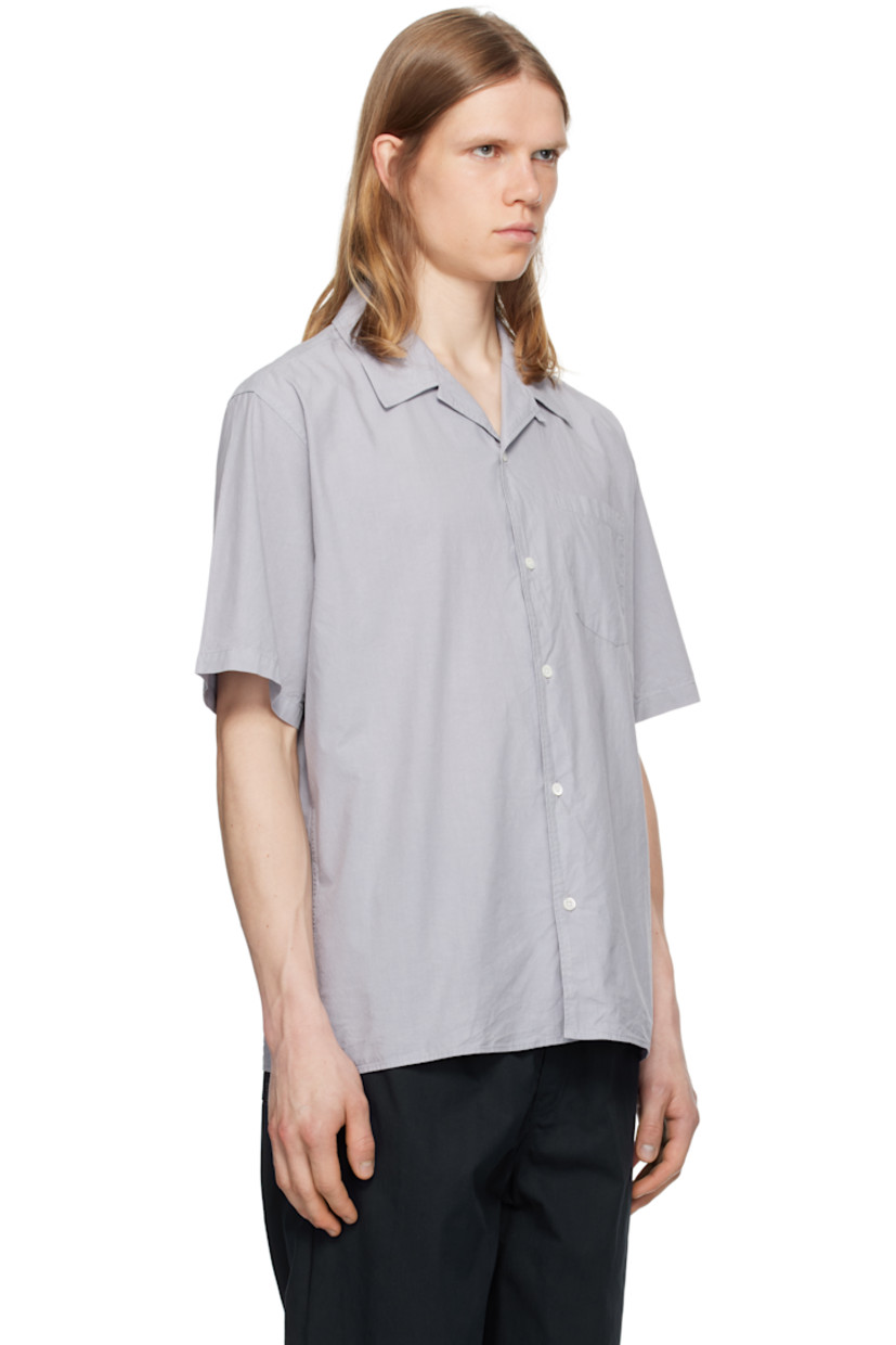 Garment-dyed cotton- and tencel-blend poplin shirt.

· Open spread collar
· Button closure
· Patch pocket
· Mother-of-pearl hardware

Supplier color: Crocus purple