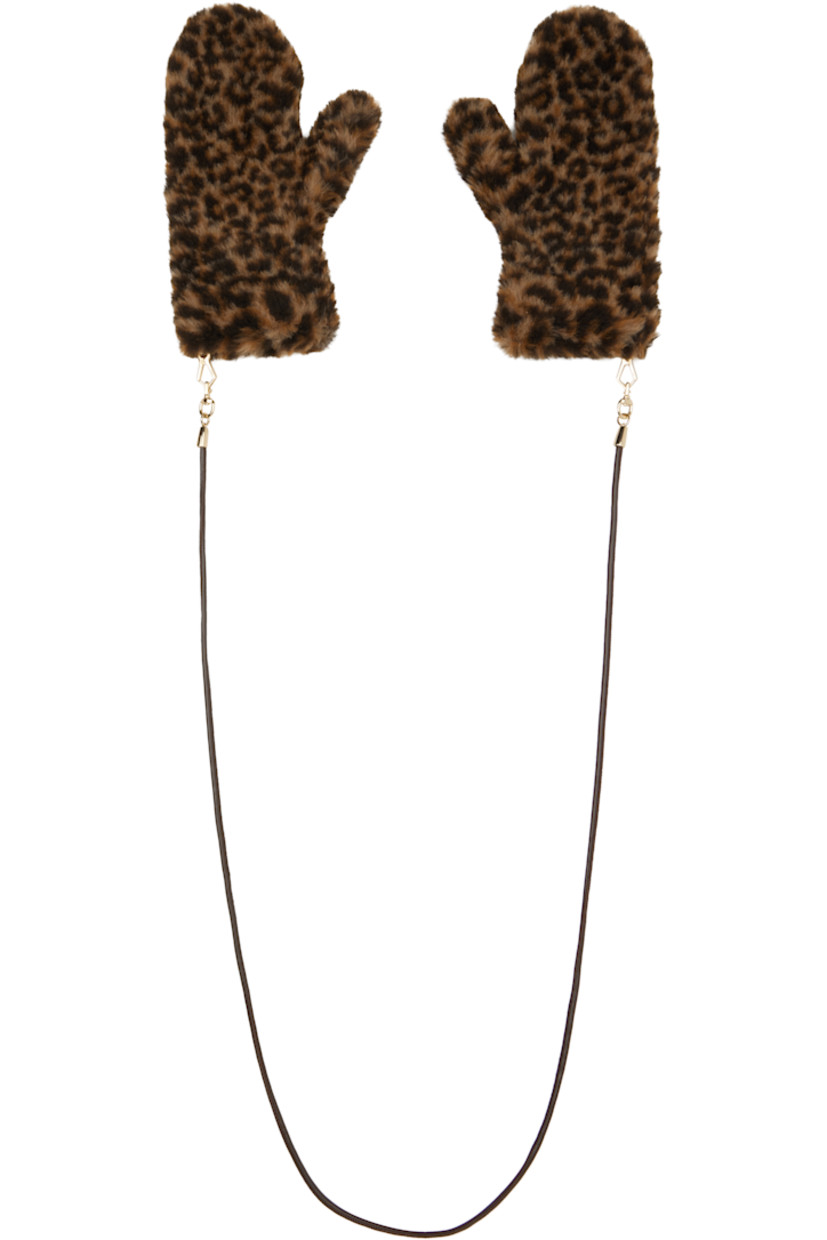 Pair of alpaca-blend fleece gloves.

· Leopard pattern printed throughout
· Detachable strap at cuffs
· Knit wool lining

Supplier color: Beige