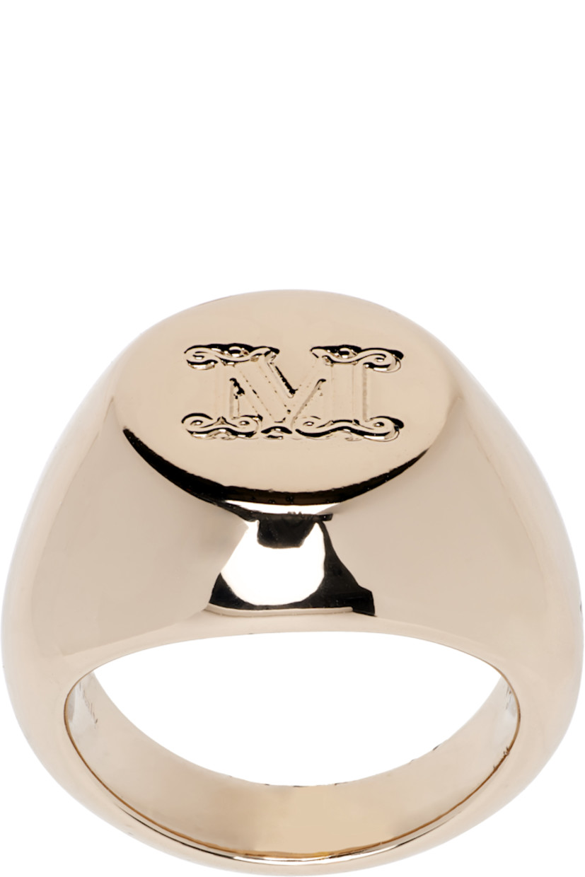 Signet ring in gold tone. Logo engraved at face.

Supplier color: Gold