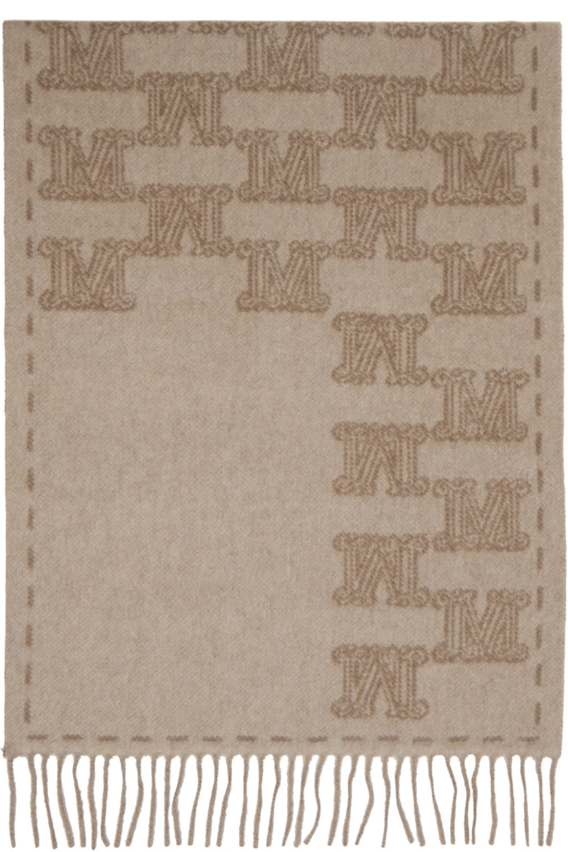 Rectangular cashmere flannel scarf.

· Jacquard logo pattern throughout
· Jacquard graphic at face
· Fringed detailing at ends
· L71" x W19"

Supplier color: Beige