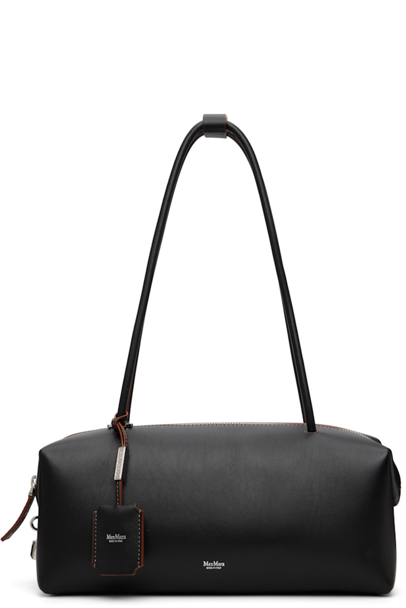 Buffed calfskin shoulder bag.

· Press-stud tab at rolled shoulder straps
· Detachable leather sheathed keys with logo plaque
· Logo stamp at face
· Padlock at side
· Bumper pads at base
· Zip closure
· Patch pocket at goatskin suede interior
· H5" x W11.5" x D5"

Supplier color: Black