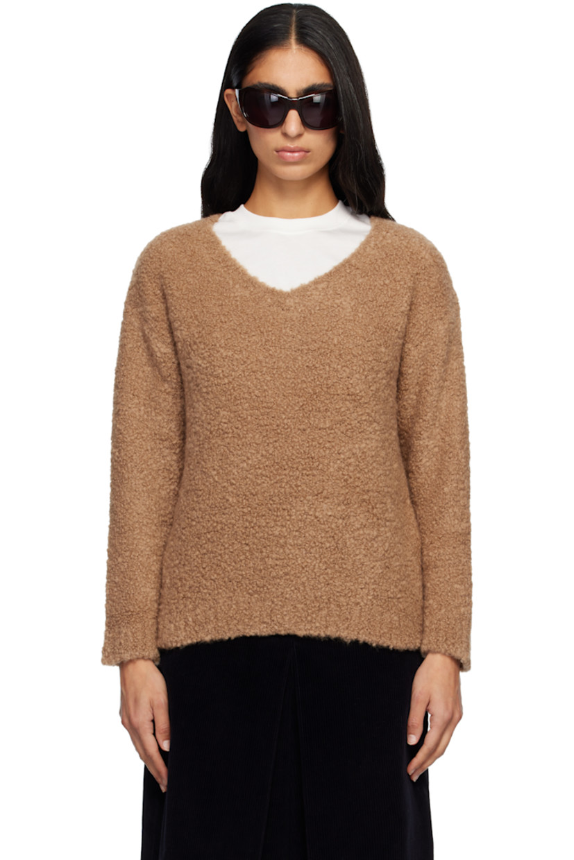 Bouclé-knit camel wool- and silk-blend sweater. Rib-knit V-neck, hem, and cuffs.

Supplier color: Camel