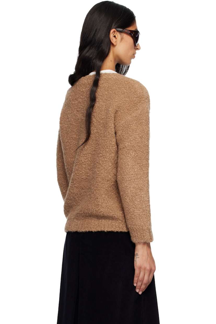 Bouclé-knit camel wool- and silk-blend sweater. Rib-knit V-neck, hem, and cuffs.

Supplier color: Camel