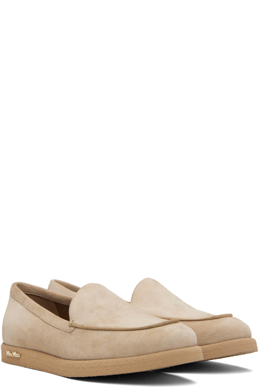 Goatskin suede slip-on loafers. 

· Moc toe
· Strap at vamp
· Lambskin nubuck and satin lining  
· Logo hardware at outer side
· Crêpe-rubber sole 

Supplier color: Camel