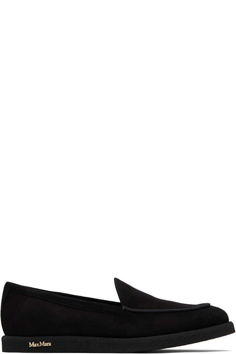 Goatskin suede slip-on loafers. 

· Moc toe
· Strap at vamp
· Lambskin nubuck and satin lining  
· Logo hardware at outer side
· Crêpe-rubber sole 

Supplier color: Black