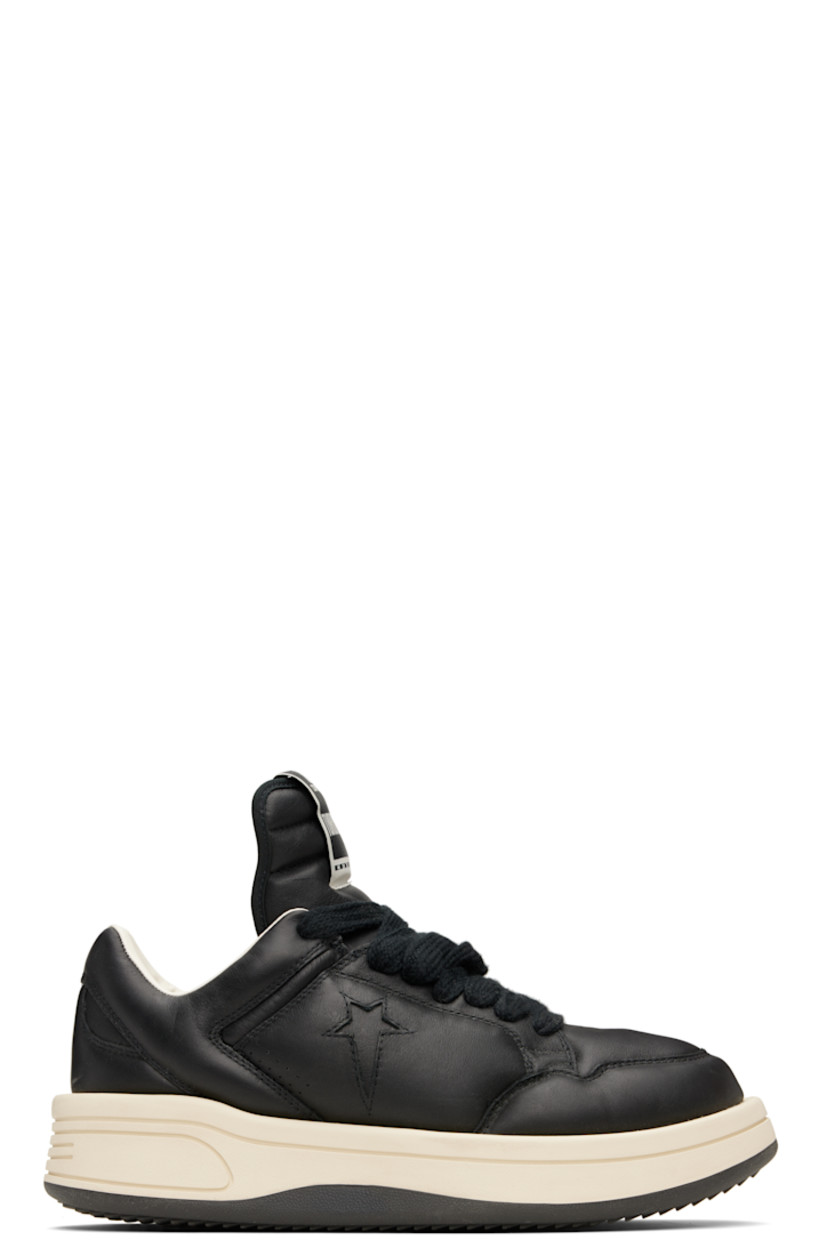 Low-top buffed leather sneakers in black.

· Perforated detailing at toe and sides
· Lace-up closure
· Logo flag at extended padded tongue
· Padded collar
· Logo cutout at sides
· Buffed faux-leather lining
· Treaded rubber platform sole
· Platform: H1.5"

Part of the Rick Owens Drkshdw x Converse collaboration.

Supplier color: Black
