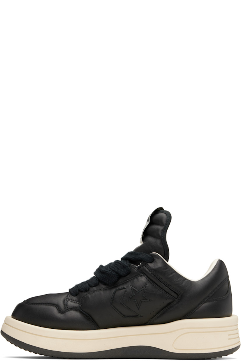 Low-top buffed leather sneakers in black.

· Perforated detailing at toe and sides
· Lace-up closure
· Logo flag at extended padded tongue
· Padded collar
· Logo cutout at sides
· Buffed faux-leather lining
· Treaded rubber platform sole
· Platform: H1.5"

Part of the Rick Owens Drkshdw x Converse collaboration.

Supplier color: Black