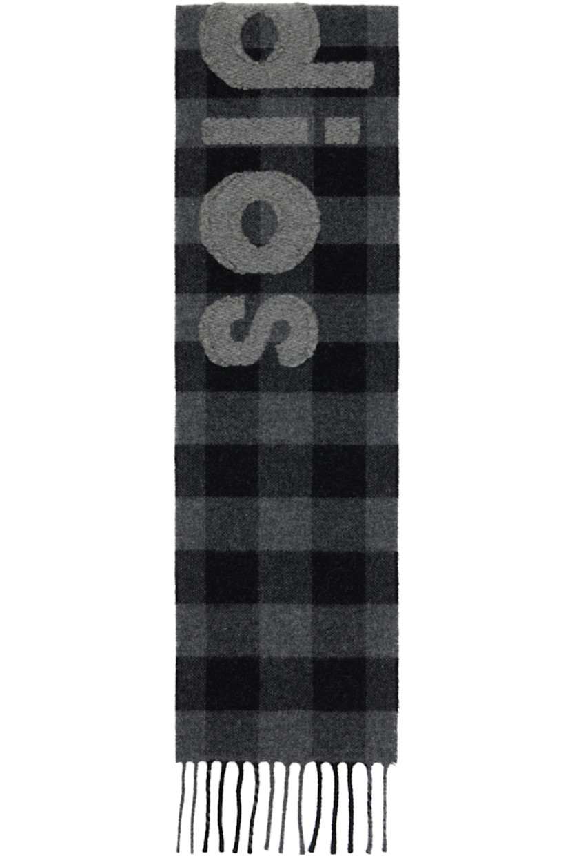 Rectangular brushed alpaca-blend flannel scarf.

· Check pattern throughout
· Logo appliqué at face
· Fringed detailing at ends
· L61.75" x W7.75"

Supplier color: Black/Grey