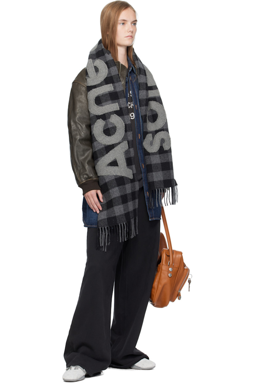 Rectangular felted knit wool-blend scarf.

· RWS-certified wool
· Check pattern throughout
· Fil-coupé logo at face
· Fringed ends 
· L80" x W14.75"

Supplier color: Black/Grey