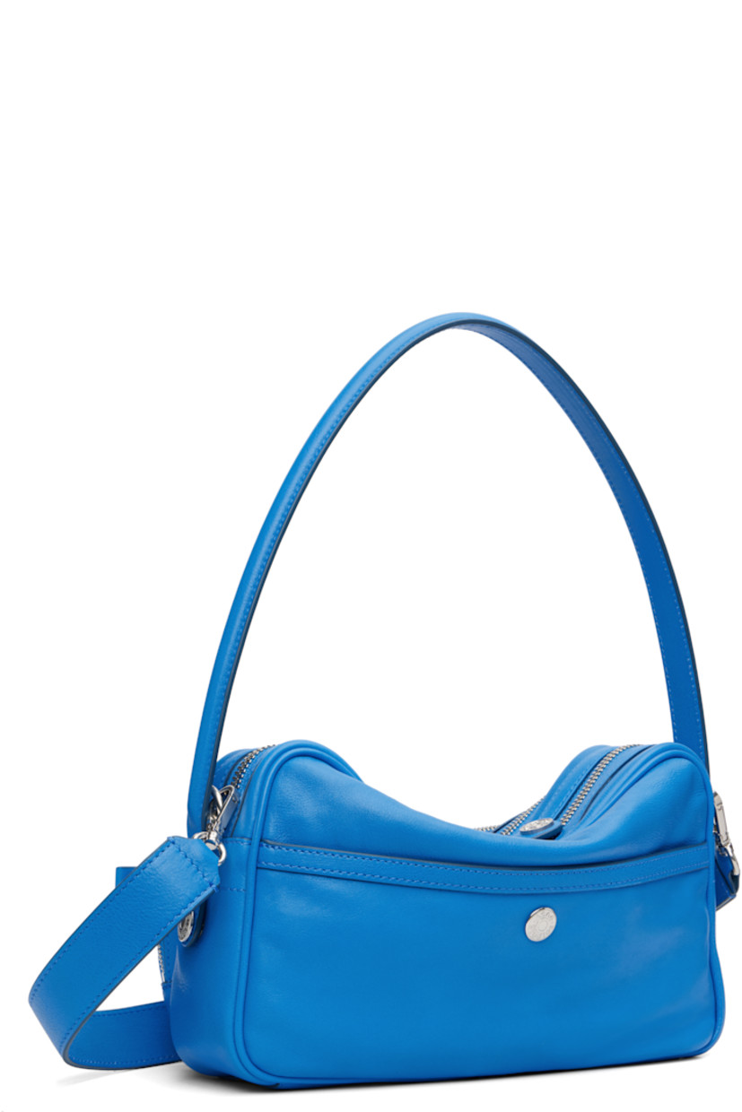 Grained calfskin shoulder bag.

· Fixed shoulder strap
· Adjustable and detachable crossbody strap
· Zip pockets and logo-engraved hardware at face
· Patch pocket at back face
· Two-way zip closure
· Faux-leather interior
· Logo-engraved silver-tone hardware
· H6.25" x W11" x D4"

Supplier color: Cobalt blue
