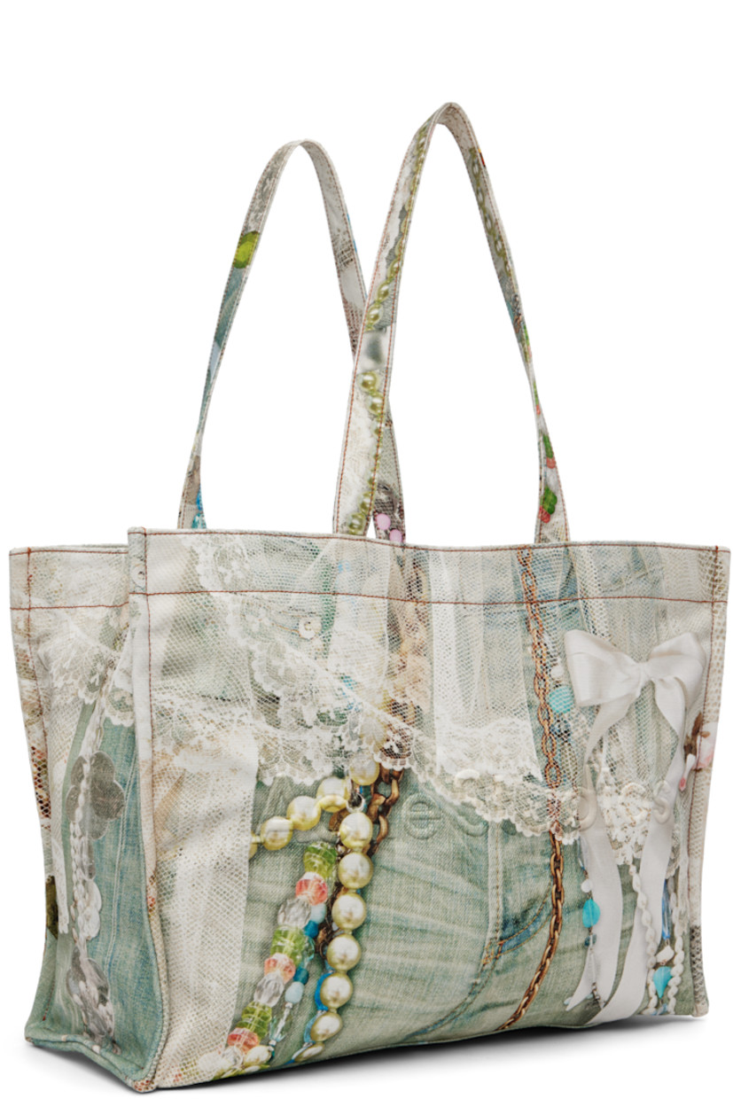Cotton canvas tote.

· Graphic printed throughout
· Fixed shoulder straps
· Logo embossed at face
· Clasp fastening at throat
· Zip and patch pocket at interior
· Twill lining
· H13" x W18" x D7"

Supplier color: White/Green