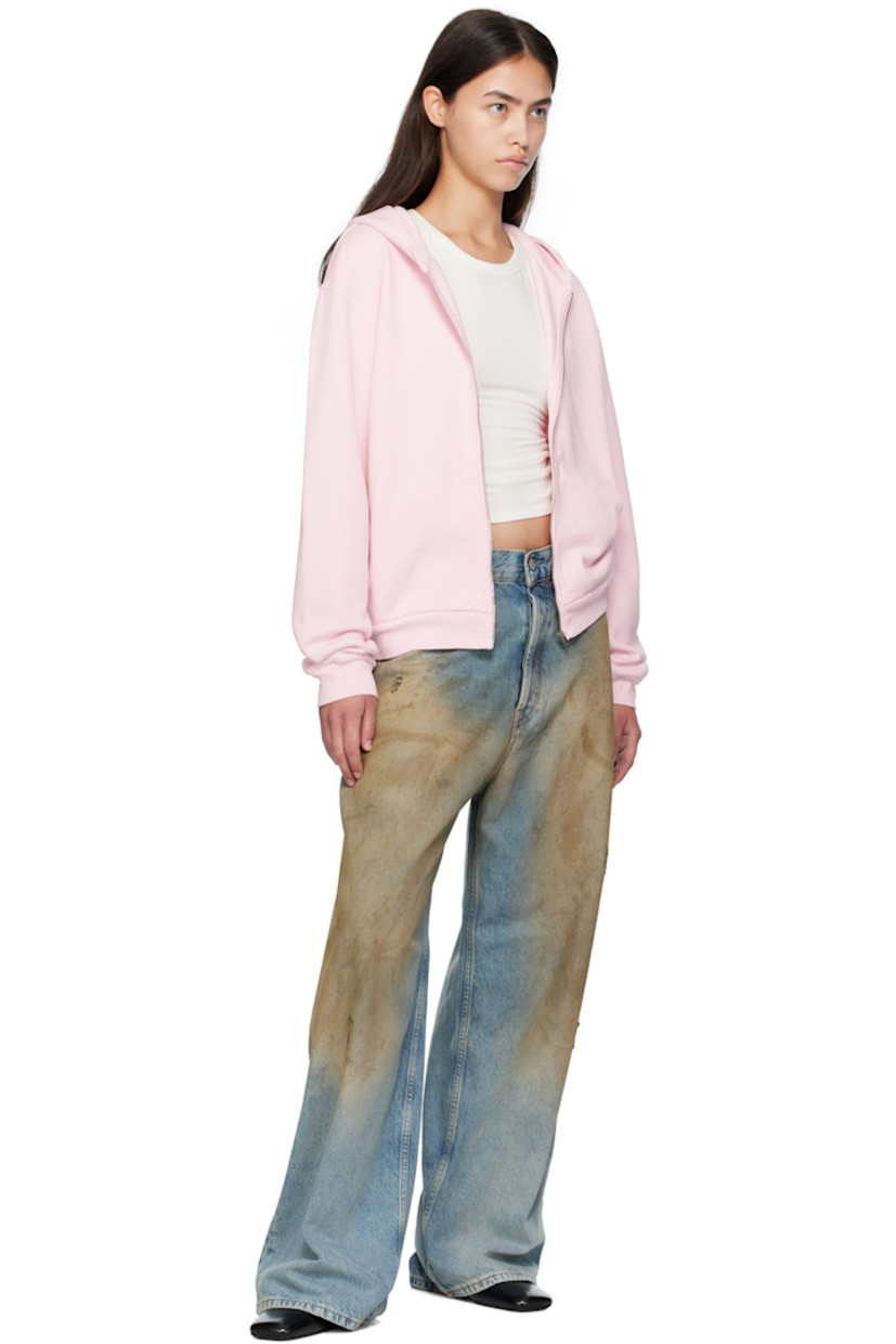 Non-stretch denim jeans. 

· Fading, distressing, and whiskering throughout 
· Loose-fit 
· Low-rise 
· Belt loops
· Five-pocket styling
· Button fly 
· Leather logo patch at back waistband 

Supplier color: Mid blue