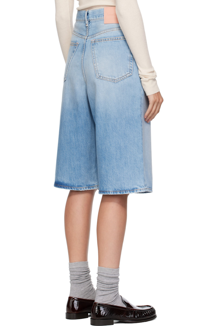 Non-stretch organic cotton denim shorts.

· Fading, distressing, and whiskering throughout
· Straight-leg
· Belt loops
· Five-pocket styling
· Zip fly
· Logo patch at back waistband
· Contrast stitching in tan

Supplier color: Light blue