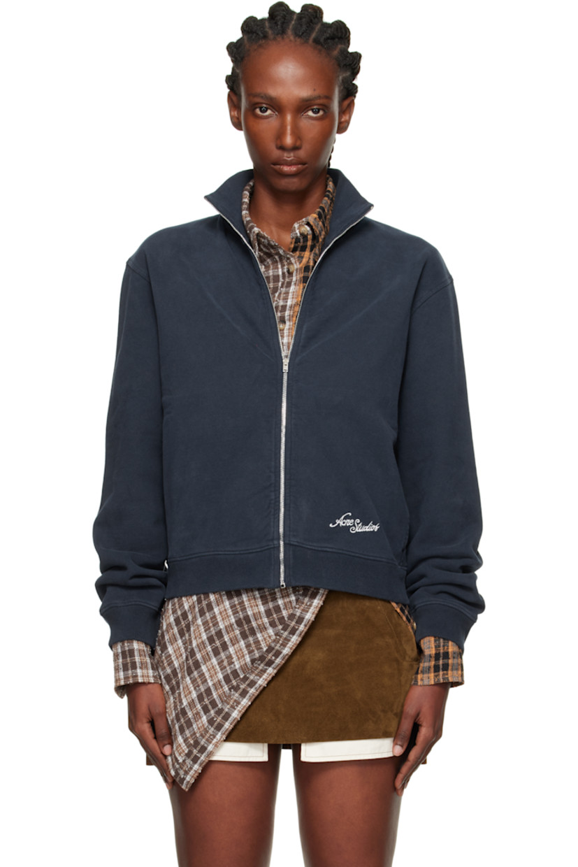 Hand-brushed organic cotton fleece jacket. 

· Fading throughout 
· Rib-knit stand collar, hem, and cuffs
· Zip closure 
· Seam pockets at waist 
· Logo embroidered at front hem and back 

Supplier color: Deep blue