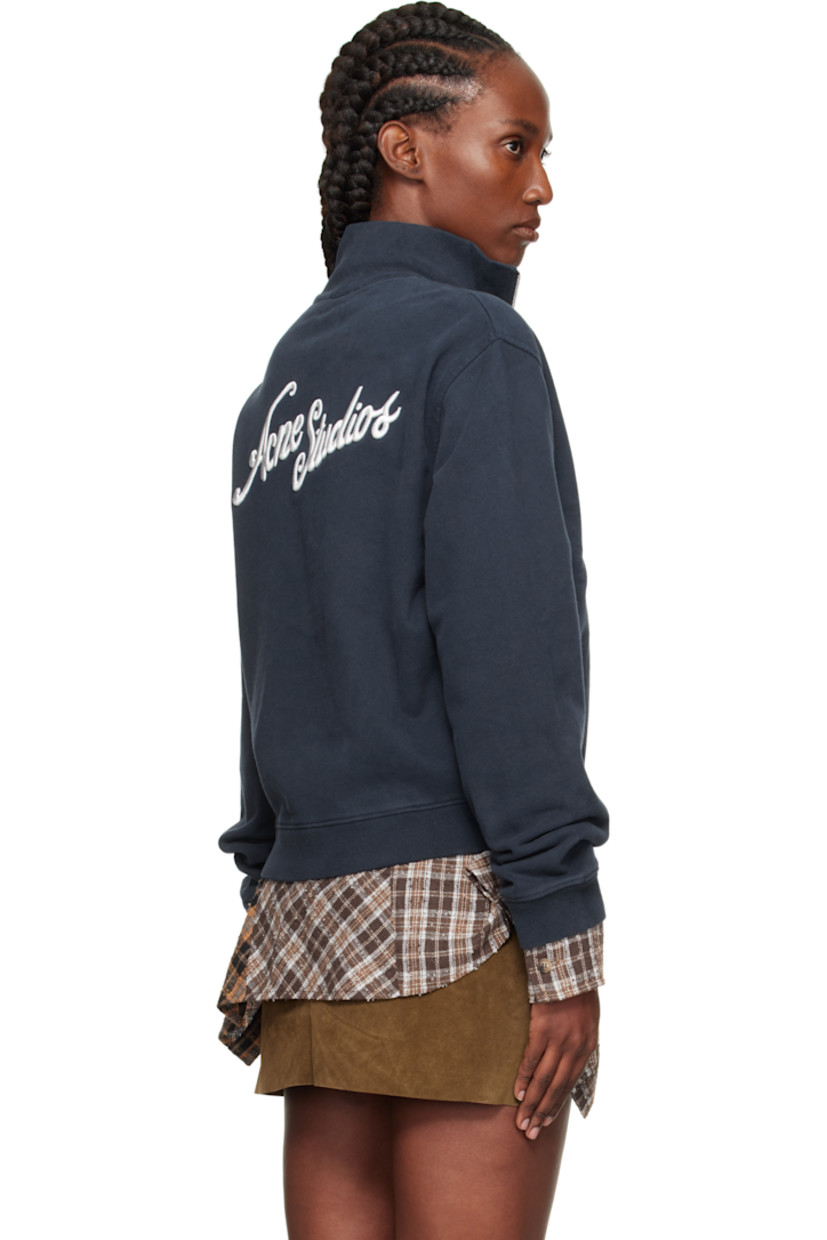 Hand-brushed organic cotton fleece jacket. 

· Fading throughout 
· Rib-knit stand collar, hem, and cuffs
· Zip closure 
· Seam pockets at waist 
· Logo embroidered at front hem and back 

Supplier color: Deep blue