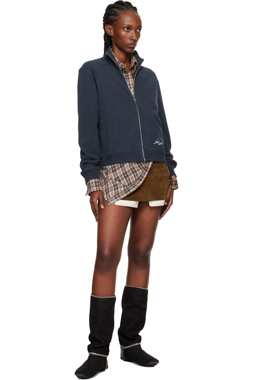 Hand-brushed organic cotton fleece jacket. 

· Fading throughout 
· Rib-knit stand collar, hem, and cuffs
· Zip closure 
· Seam pockets at waist 
· Logo embroidered at front hem and back 

Supplier color: Deep blue