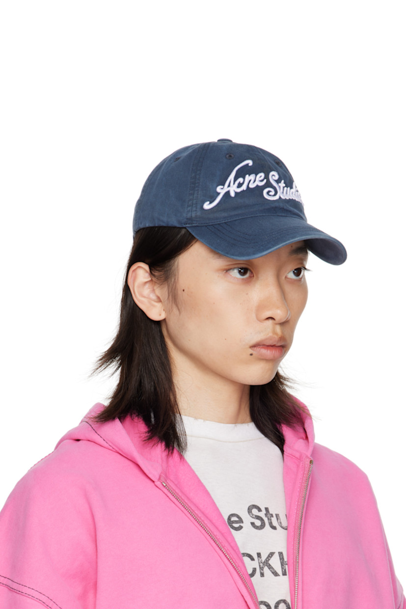 Organic cotton twill cap.

· Fading throughout
· Embroidered eyelets at crown
· Logo embroidered at face and brim
· Curved brim
· Cinch fastening

Supplier color: Deep blue