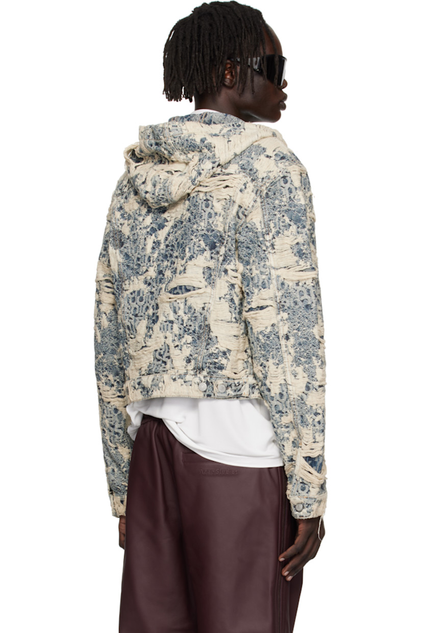 Non-stretch organic cotton denim jacket.

· Enzyme-washed
· Distressing and jacquard logo pattern throughout
· Integrated hood
· Button closure
· Flap pockets at chest
· Welt pockets at waist
· Cropped hem
· Buttoned cuffs
· Adjustable button tabs at back hem
· Logo-engraved silver-tone hardware

Supplier color: Mid blue