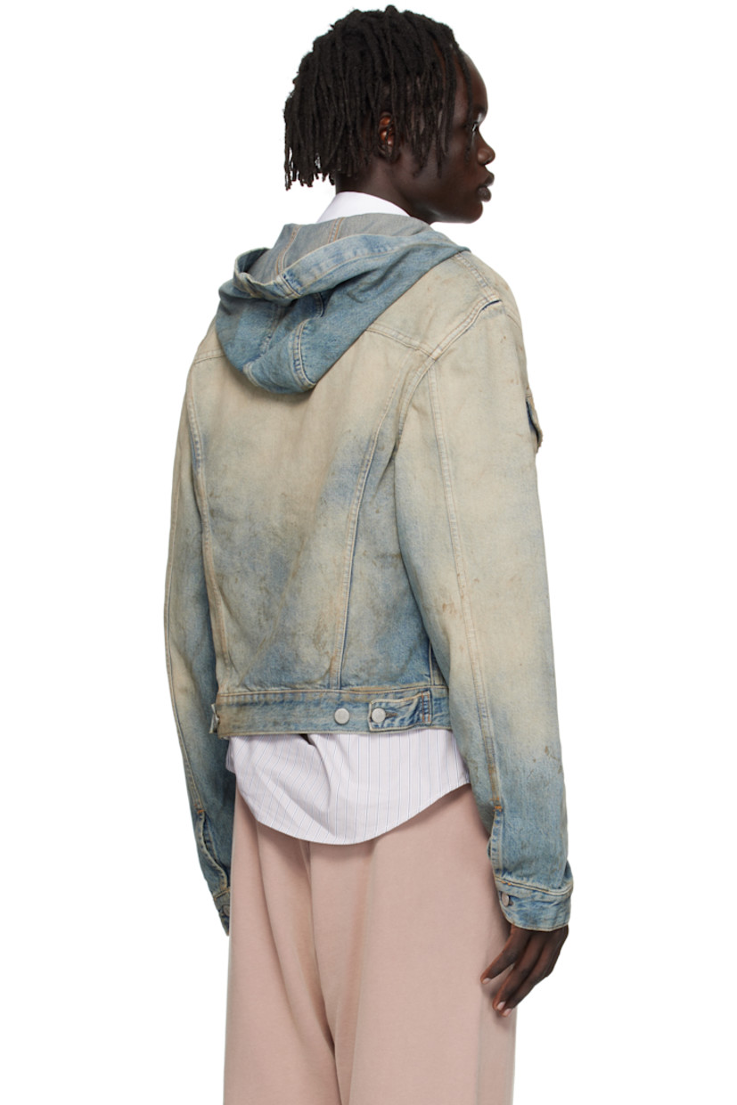 Non-stretch organic cotton denim jacket.

· Discoloration, smudging, and subtle distressing throughout
· Integrated hood
· Button closure
· Flap pockets at chest
· Welt pockets at waist
· Cropped hem
· Buttoned cuffs
· Adjustable button tabs at back hem
· Logo-engraved silver-tone hardware
· Contrast stitching in tan

Supplier color: Mid blue