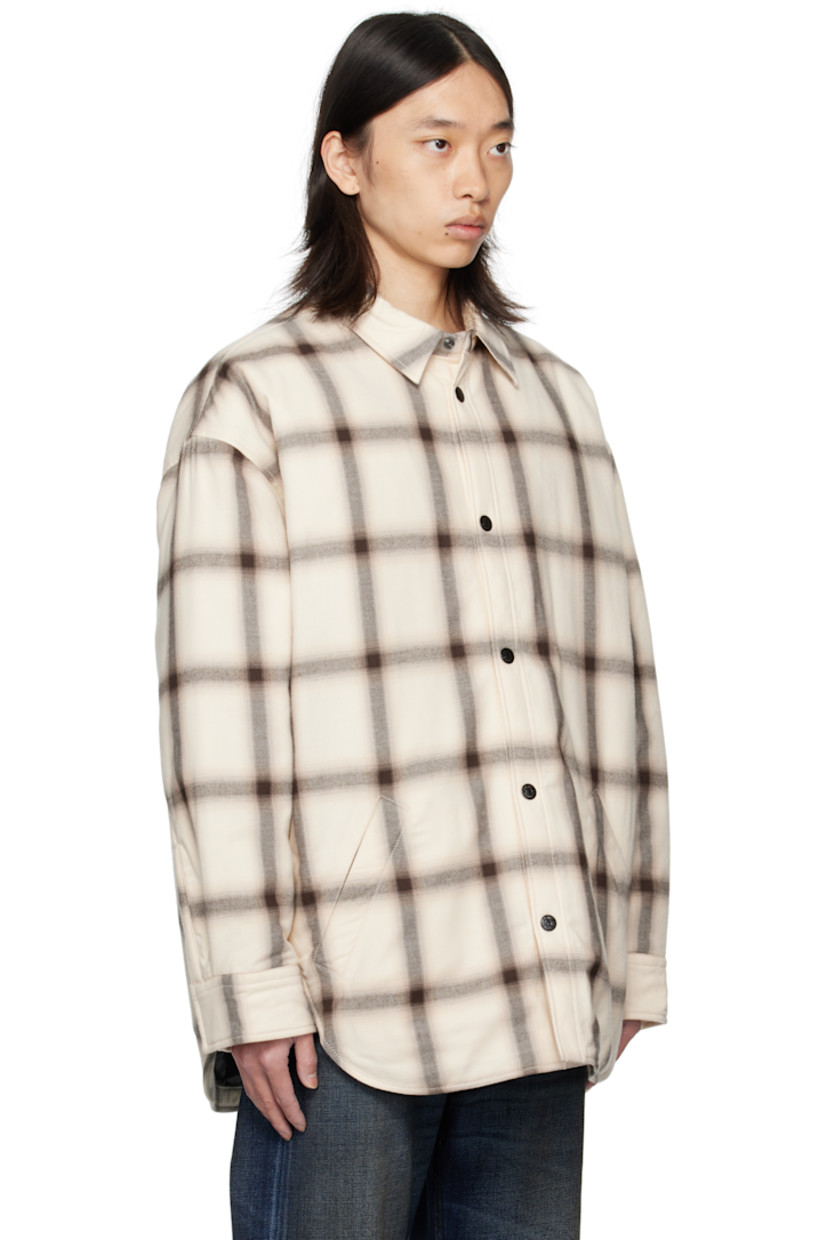 Insulated organic cotton flannel overshirt. 

· Check pattern throughout
· Spread collar
· Press-stud closure
· Welt pockets at waist
· Shirttail hem
· Dropped shoulders
· Press-stud barrel cuffs
· Logo embroidered at back collar
· Pleats at back yoke
· Quilted satin lining

Supplier color: Beige/Multi