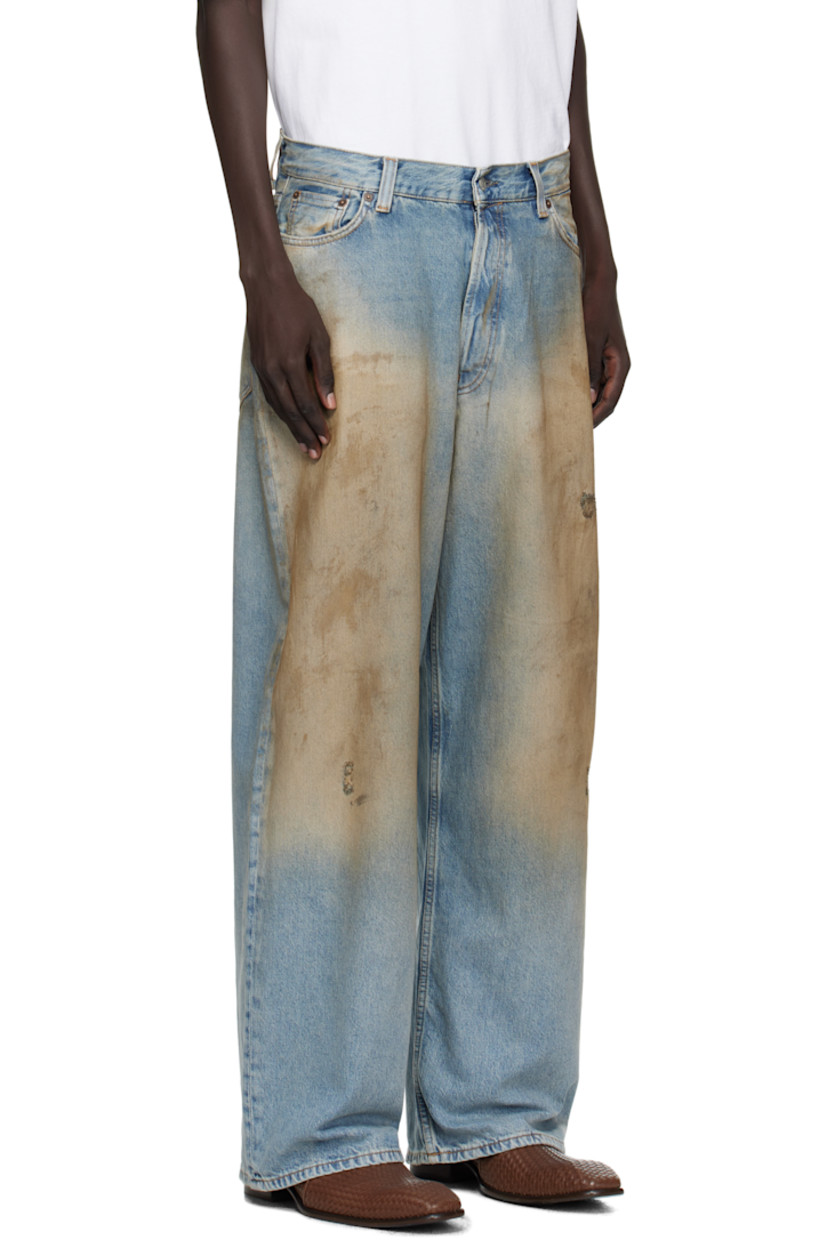 Stonewashed non-stretch denim jeans.

· Whiskering, smudging and fading throughout
· Loose-fit
· Low-rise
· Belt loops
· Five-pocket styling
· Button fly
· Leather logo patch at back waistband
· Logo-engraved silver- and copper-tone hardware
· Contrast stitching in tan

Supplier color: Mid Blue