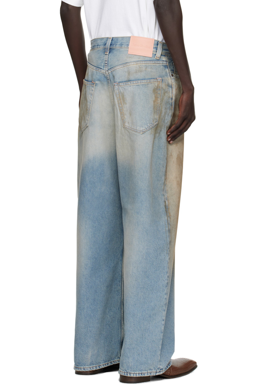 Stonewashed non-stretch denim jeans.

· Whiskering, smudging and fading throughout
· Loose-fit
· Low-rise
· Belt loops
· Five-pocket styling
· Button fly
· Leather logo patch at back waistband
· Logo-engraved silver- and copper-tone hardware
· Contrast stitching in tan

Supplier color: Mid Blue
